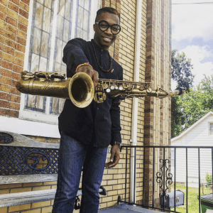 Scooter Brown, Jr. Scooter Brown, Jr. holding saxophone