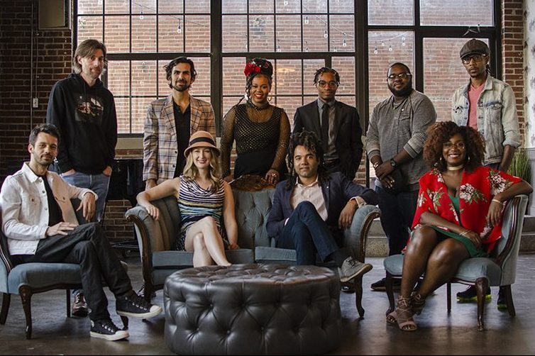 group of 10 musicians sitting and standing